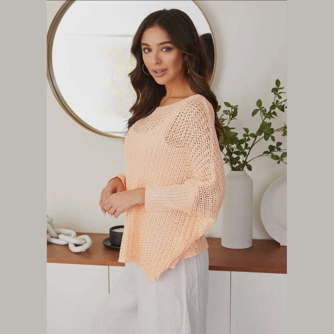 Made in Italy lightweight boatneck knit sweater with dropped shoulders, offering effortless elegance and coastal style