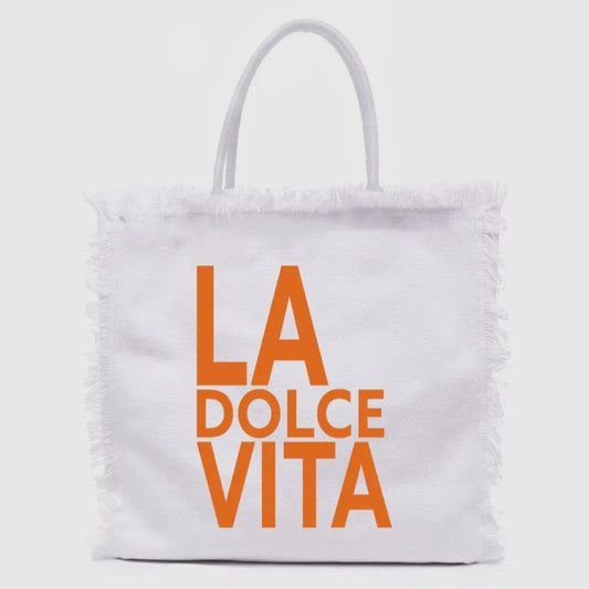 La Dolce Vita woven tote bag with colorful and embroidered lettering, perfect for beach days or market strolls
