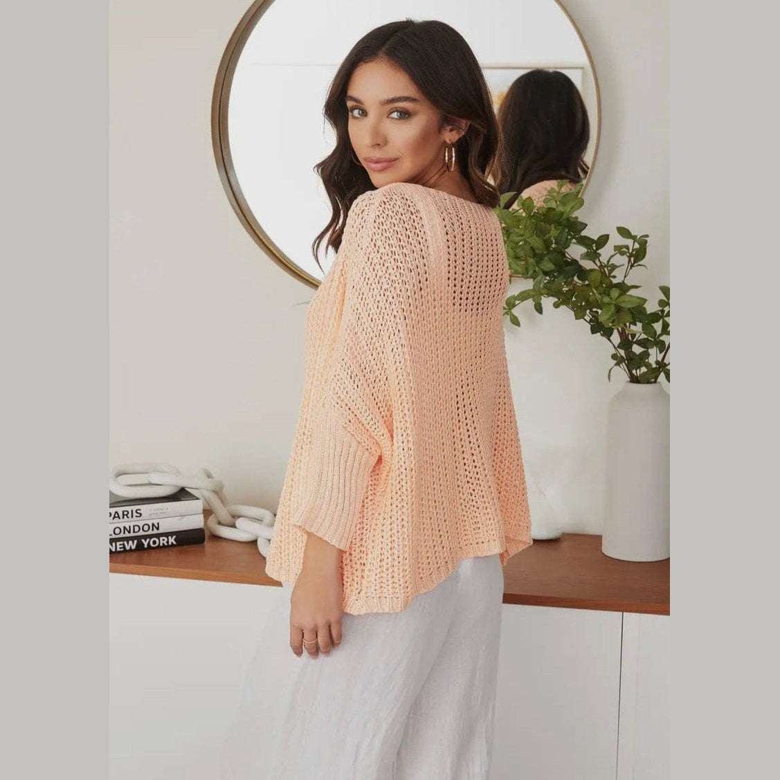 Made in Italy lightweight boatneck knit sweater with dropped shoulders, offering effortless elegance and coastal style