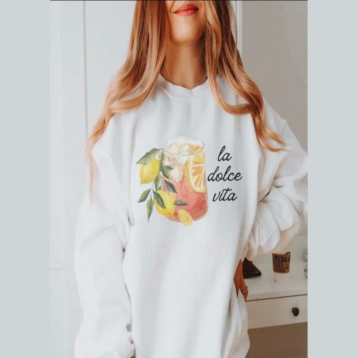 La Dolce Vita graphic sweatshirt in soft neutral tones, celebrating the sweet life with Italian charm and comfort